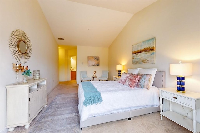 bedroom featuring lofted ceiling, light carpet, and visible vents