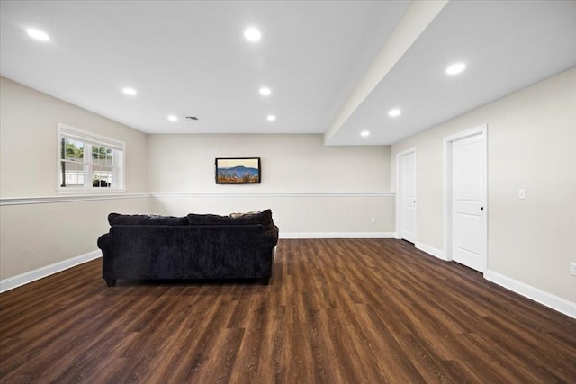 living area featuring visible vents, recessed lighting, wood finished floors, and baseboards