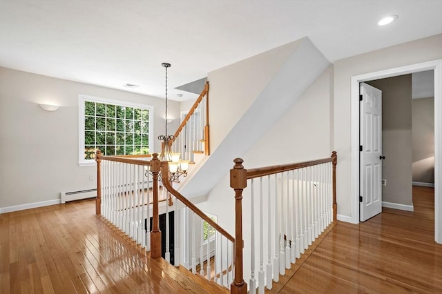 14 Nourse St, Westborough, MA 01581 - corridor featuring an upstairs landing, hardwood / wood-style floors, a baseboard heating unit, and recessed lighting