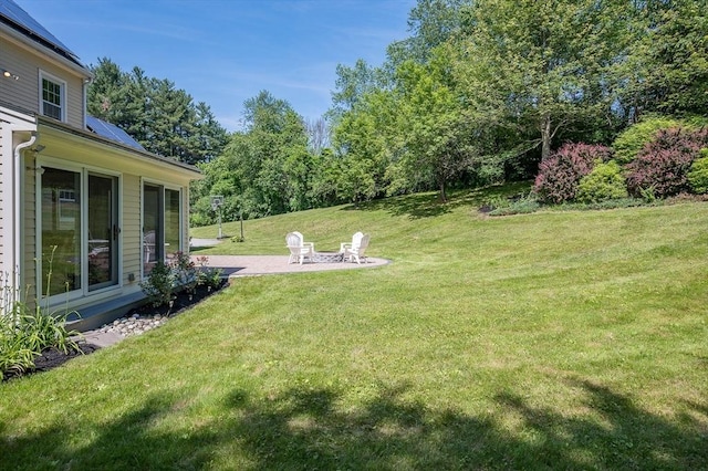 14 Nourse St, Westborough, MA 01581 - view of green lawn with a patio and an outdoor fire pit
