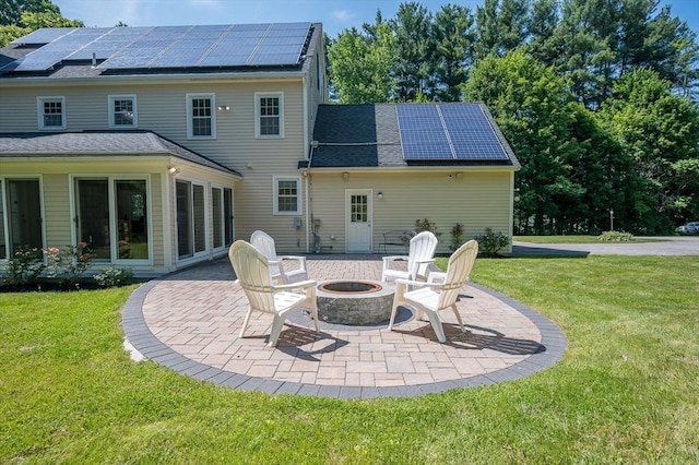 14 Nourse St, Westborough, MA 01581 - back of house featuring roof mounted solar panels, an outdoor fire pit, a patio area, and a yard