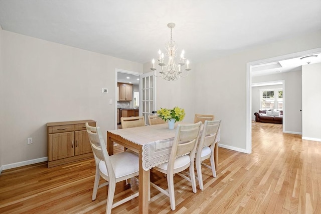 14 Nourse St, Westborough, MA 01581 - dining area with light wood-type flooring and a chandelier
