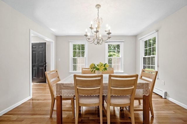 14 Nourse St, Westborough, MA 01581 - dining area featuring baseboard heating, a chandelier, and light wood-style flooring