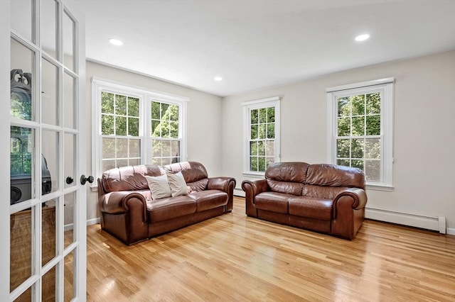 14 Nourse St, Westborough, MA 01581 - living area with light wood finished floors, a baseboard heating unit, recessed lighting, and french doors