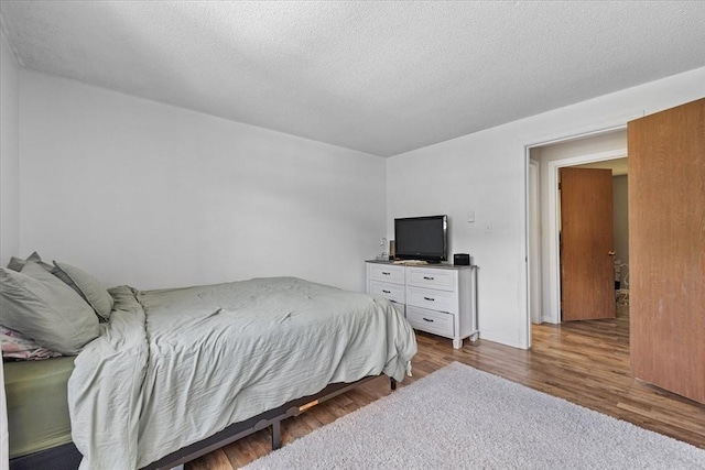 837 Partridgeville Rd Unit 2B, Athol, MA 01331 - bedroom featuring wood finished floors and a textured ceiling