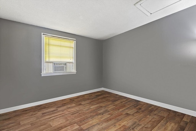 837 Partridgeville Rd Unit 2B, Athol, MA 01331 - spare room with dark wood-type flooring, cooling unit, and a textured ceiling