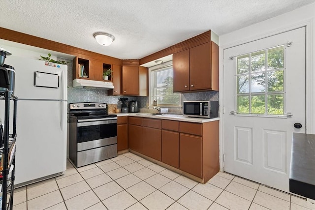 837 Partridgeville Rd Unit 2B, Athol, MA 01331 - kitchen with appliances with stainless steel finishes, under cabinet range hood, light countertops, backsplash, and a textured ceiling