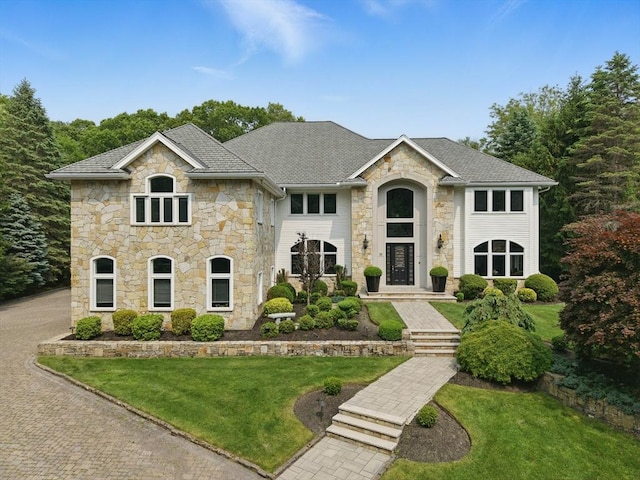 65 Saile Way, North Andover, MA 01845 - view of front of property with stone siding and a front lawn