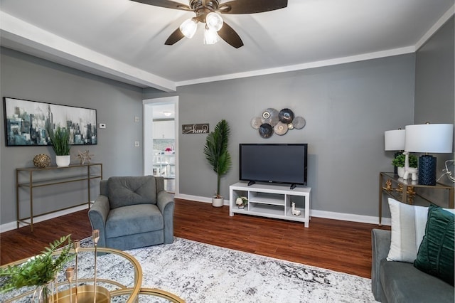 living room with ceiling fan, hardwood / wood-style flooring, and ornamental molding