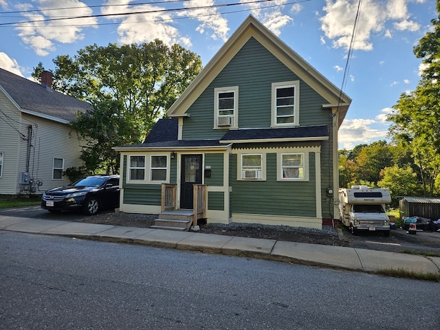 view of front of house featuring cooling unit