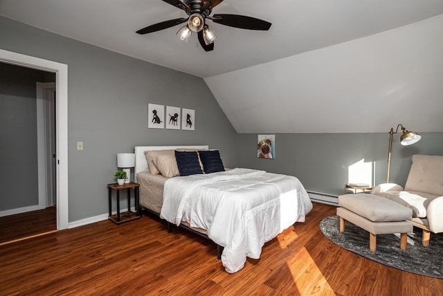 bedroom featuring vaulted ceiling, ceiling fan, baseboard heating, and dark hardwood / wood-style floors