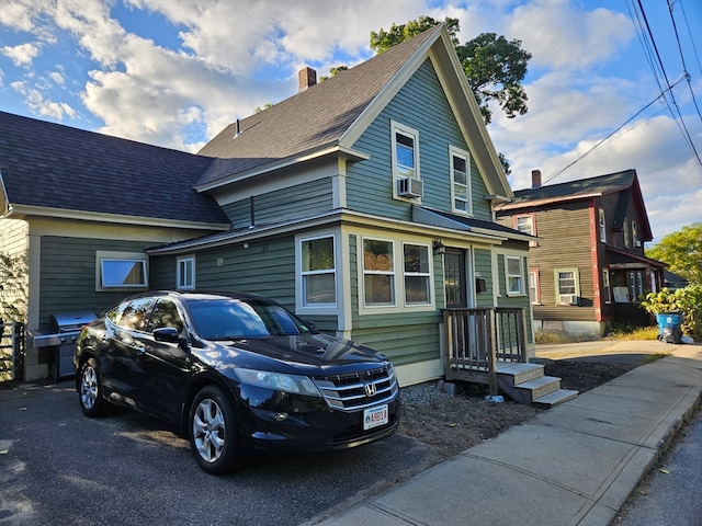 view of front of house featuring cooling unit