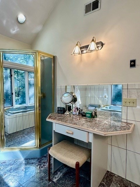 bathroom with lofted ceiling