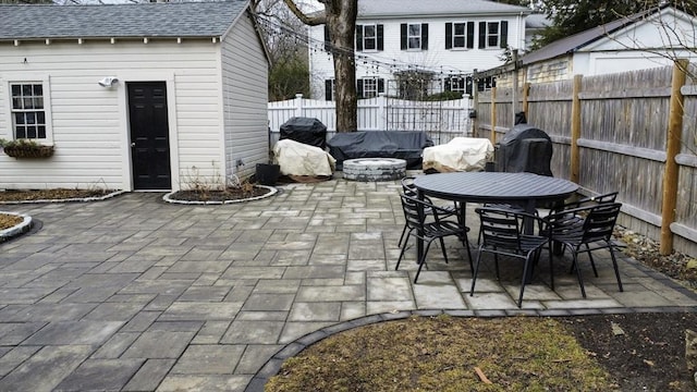 view of patio featuring a grill and a fire pit