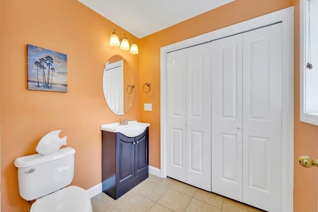 3 White Tail Dr, Tyngsborough, MA 01879 - bathroom featuring a closet, vanity, toilet, tile patterned floors, and baseboards