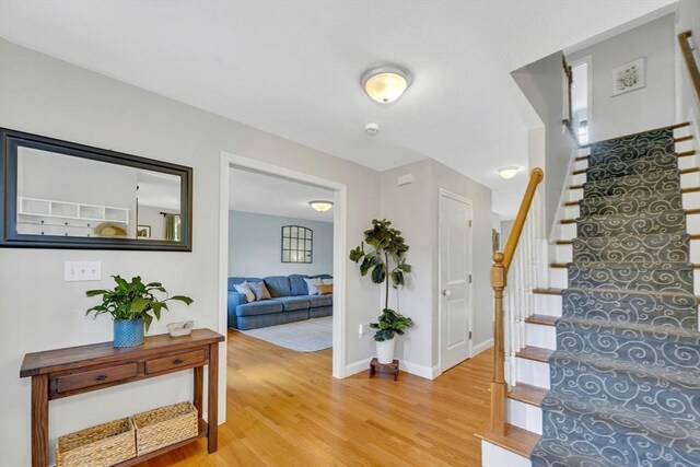 3 White Tail Dr, Tyngsborough, MA 01879 - stairs with wood finished floors and baseboards