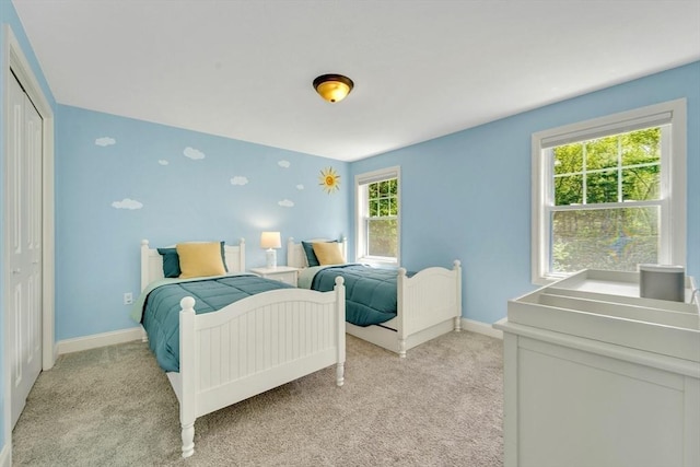 3 White Tail Dr, Tyngsborough, MA 01879 - bedroom featuring multiple windows, light colored carpet, baseboards, and a closet