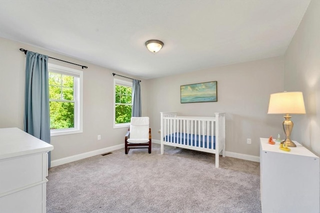 3 White Tail Dr, Tyngsborough, MA 01879 - bedroom featuring light carpet, baseboards, and a crib