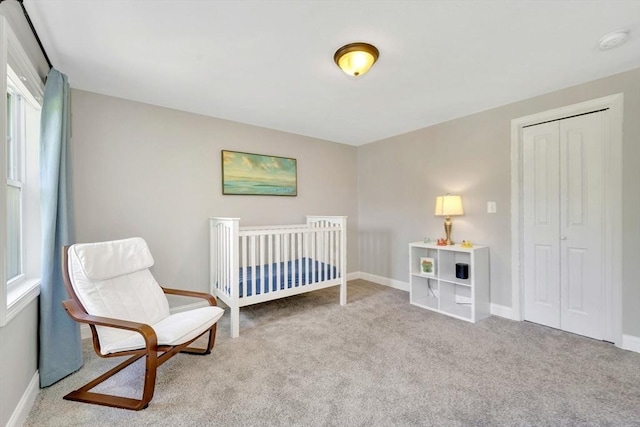 3 White Tail Dr, Tyngsborough, MA 01879 - carpeted bedroom with baseboards, a closet, and a crib