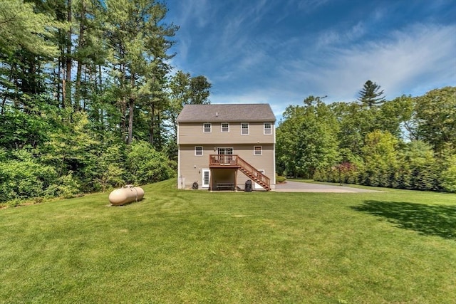3 White Tail Dr, Tyngsborough, MA 01879 - rear view of house with stairs, a deck, and a lawn
