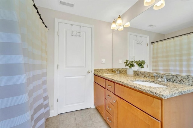 3 White Tail Dr, Tyngsborough, MA 01879 - full bathroom with double vanity and tile patterned flooring