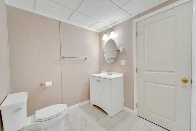 3 White Tail Dr, Tyngsborough, MA 01879 - bathroom featuring toilet, vanity, marble look tile flooring, baseboards, and ornamental molding