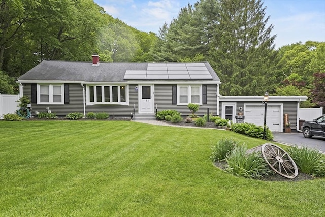 121 Rockland Rd, Auburn, MA 01501 - view of front of house with asphalt driveway, entry steps, a chimney, solar panels, and an attached garage