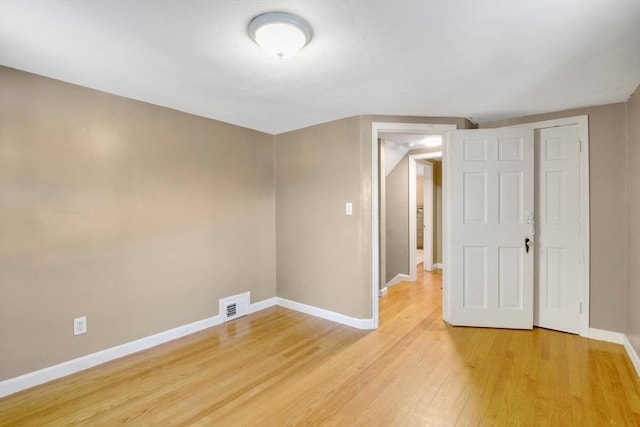 spare room with light wood-type flooring