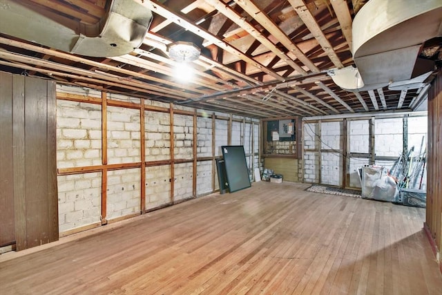 basement with hardwood / wood-style floors