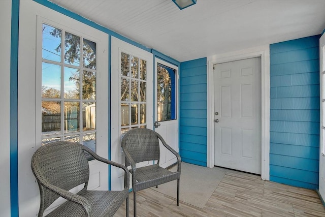 view of exterior entry with covered porch