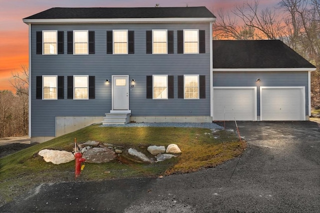 13R Pine Hill Way Unit 13, Harvard, MA 01451 - colonial-style house with entry steps, a front lawn, driveway, and an attached garage