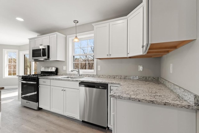 13R Pine Hill Way Unit 13, Harvard, MA 01451 - kitchen with recessed lighting, a sink, stainless steel appliances, light wood-style flooring, and white cabinets