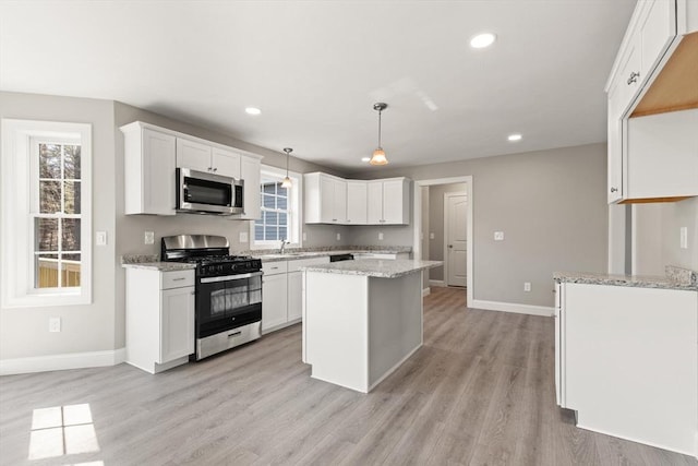 13R Pine Hill Way Unit 13, Harvard, MA 01451 - kitchen featuring appliances with stainless steel finishes, white cabinetry, light wood-type flooring, and baseboards
