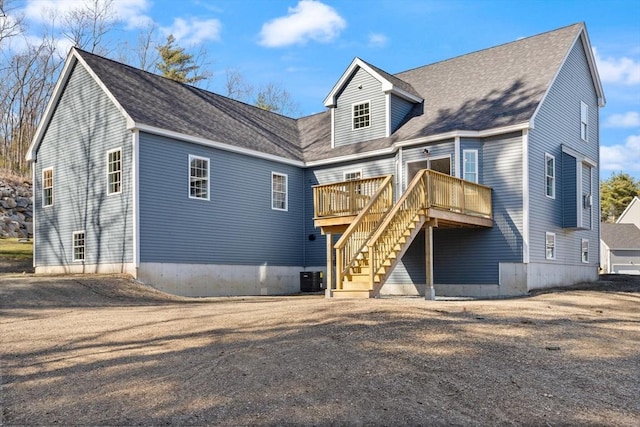 13R Pine Hill Way Unit 13, Harvard, MA 01451 - rear view of house with roof with shingles, a wooden deck, central AC unit, and stairs