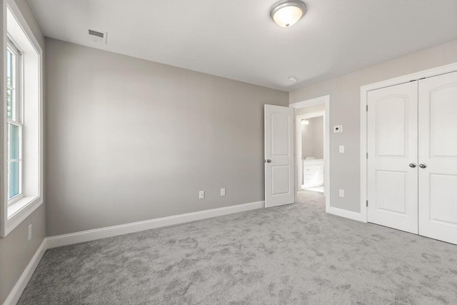 13R Pine Hill Way Unit 13, Harvard, MA 01451 - unfurnished bedroom featuring a closet, visible vents, carpet floors, and baseboards
