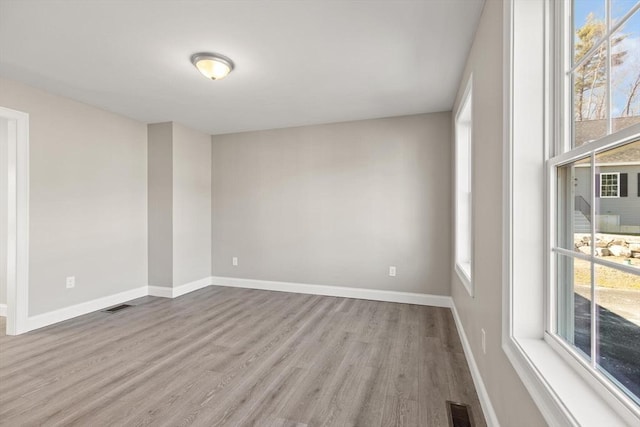 13R Pine Hill Way Unit 13, Harvard, MA 01451 - unfurnished room featuring wood finished floors, visible vents, and plenty of natural light