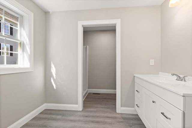 13R Pine Hill Way Unit 13, Harvard, MA 01451 - bathroom featuring vanity, wood finished floors, and baseboards