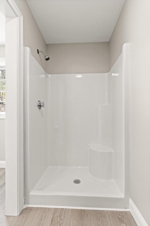 13R Pine Hill Way Unit 13, Harvard, MA 01451 - bathroom with wood finished floors, walk in shower, and baseboards