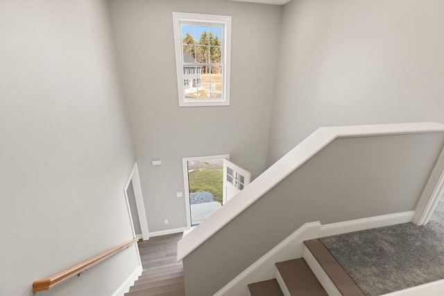 13R Pine Hill Way Unit 13, Harvard, MA 01451 - stairway featuring wood finished floors, a high ceiling, and baseboards