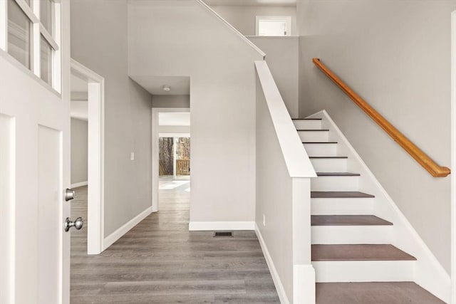 13R Pine Hill Way Unit 13, Harvard, MA 01451 - staircase with baseboards, visible vents, and wood finished floors
