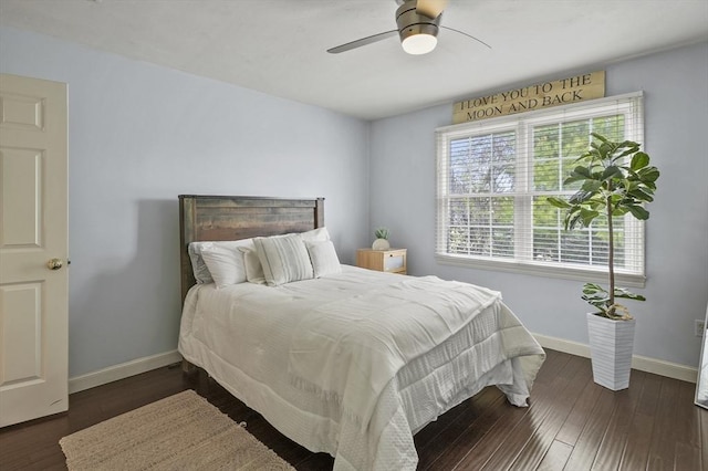 bedroom featuring baseboards, ceiling fan, and wood finished floors
