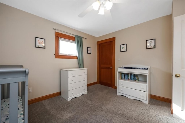 unfurnished bedroom with baseboards, carpet floors, and a ceiling fan