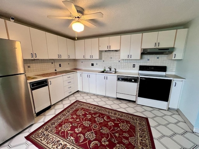 kitchen with white cabinets, white appliances, and sink