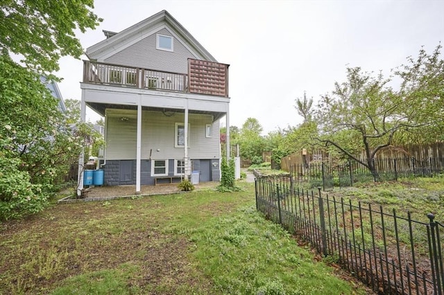 back of property with a balcony