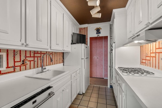 85 E India Row Unit 18B, Boston, MA 02110 - kitchen with gas cooktop, dishwashing machine, under cabinet range hood, and white cabinetry