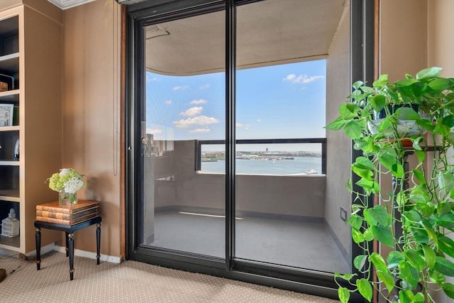 85 E India Row Unit 18B, Boston, MA 02110 - entryway featuring a water view and carpet floors