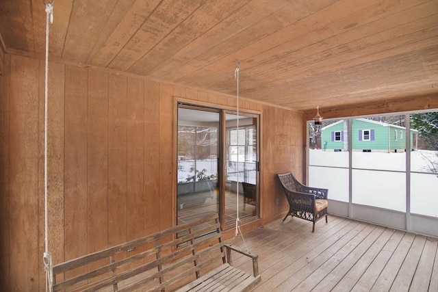 sunroom / solarium featuring wood ceiling