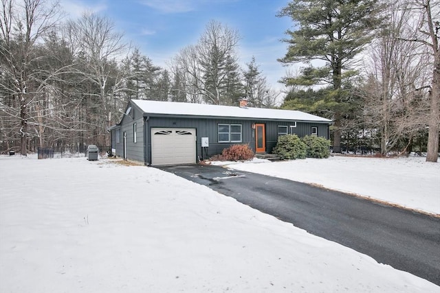 single story home featuring a garage