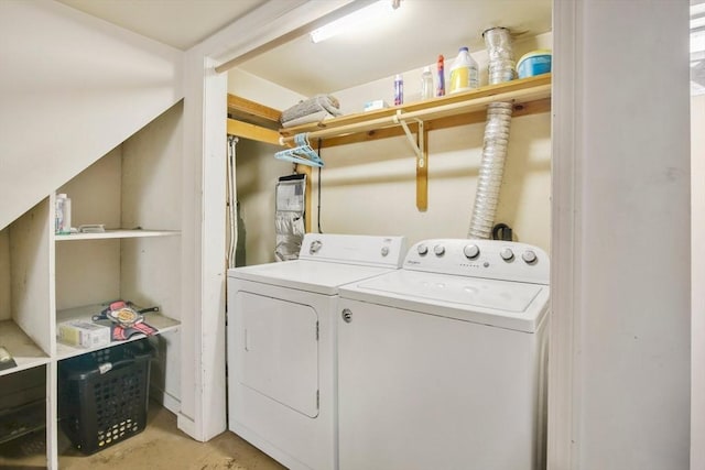 laundry area with washing machine and dryer