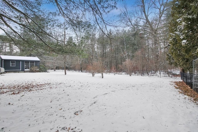 view of yard layered in snow